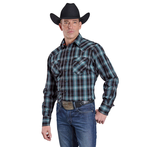 Man wearing a plaid shirt, jeans, and a cowboy hat on a white background