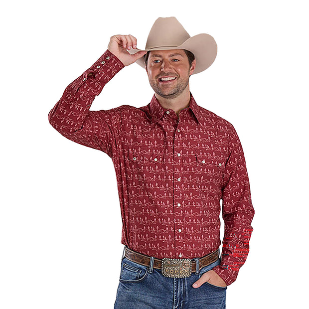 Man wearing a red patterned shirt, blue jeans, and a beige cowboy hat on a white background