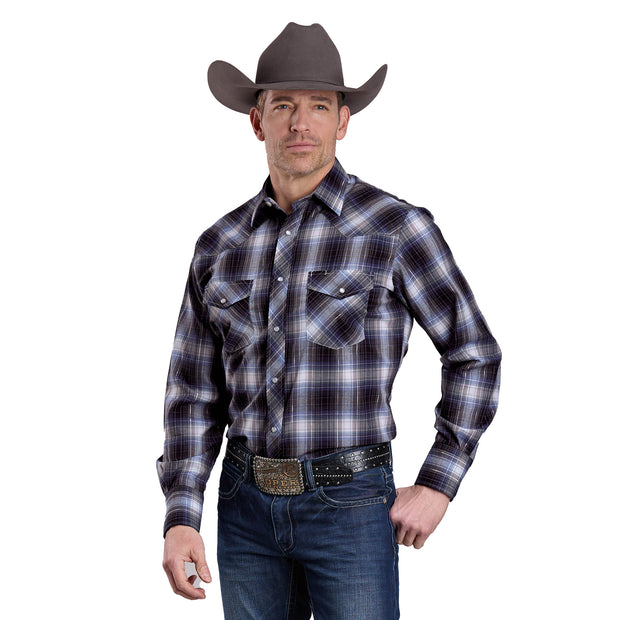 Man wearing a plaid shirt, cowboy hat, and jeans on a white background