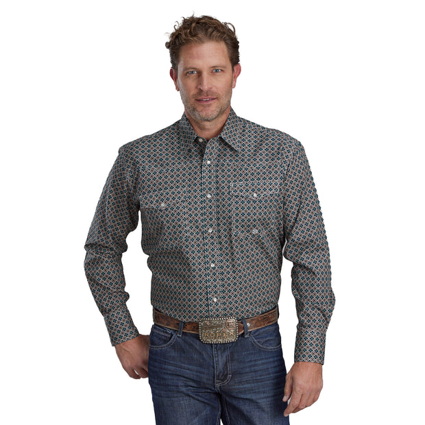 Man wearing a patterned shirt and jeans on a white background