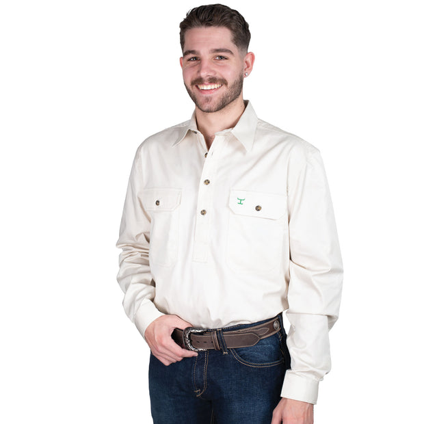 Man wearing a white button-up shirt with a logo on a white background