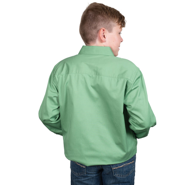 Child wearing a green shirt with a brand logo on a white background