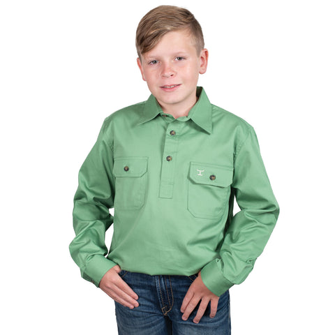 Child wearing a green shirt with a brand logo on a white background