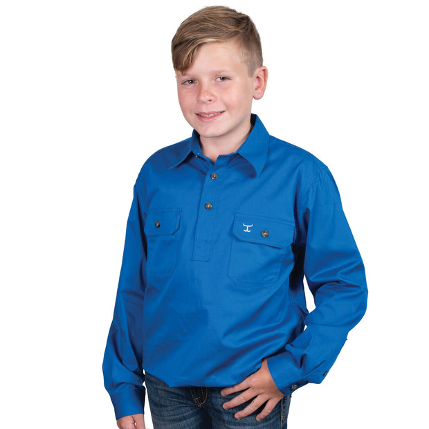 Child wearing a blue shirt on a white background