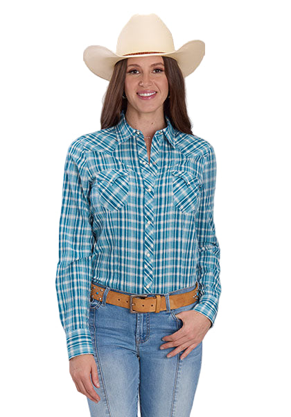 Woman wearing a blue plaid shirt, jeans, and a cowboy hat on a gray background