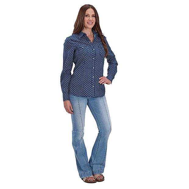 Woman wearing a blue patterned shirt and jeans on a white background
