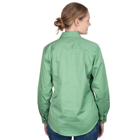 Person wearing a green shirt on a white background