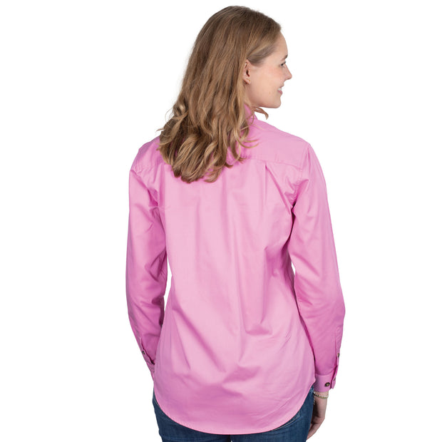 Woman wearing a pink shirt on a white background