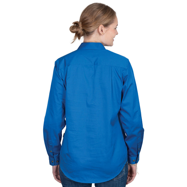 Woman wearing a blue shirt with a logo on a white background