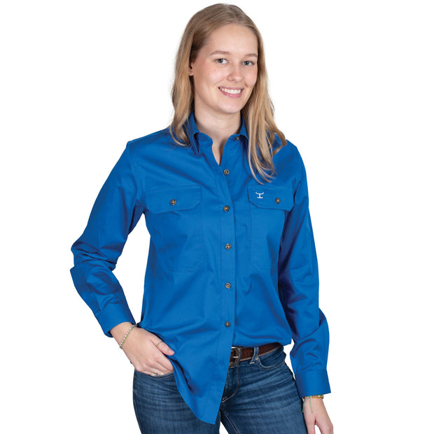 Woman wearing a blue shirt with a logo on a white background