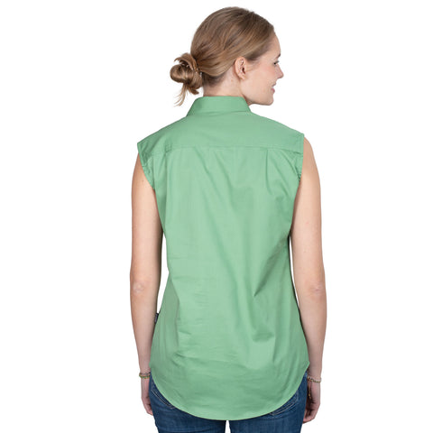 Woman wearing a green sleeveless shirt on a white background