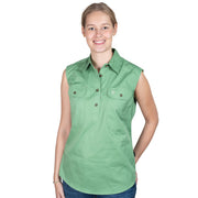 Woman wearing a green sleeveless shirt on a white background