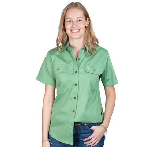 Woman wearing a green shirt with a white background
