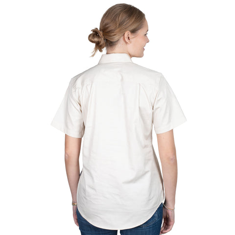 Woman wearing a white short-sleeve shirt with a logo on a white background