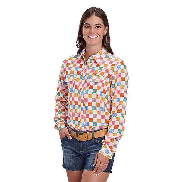 Woman wearing a colorful checkered shirt and denim shorts on a white background