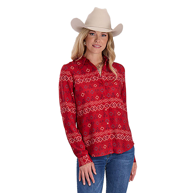 Woman wearing a red patterned shirt and beige cowboy hat on a white background