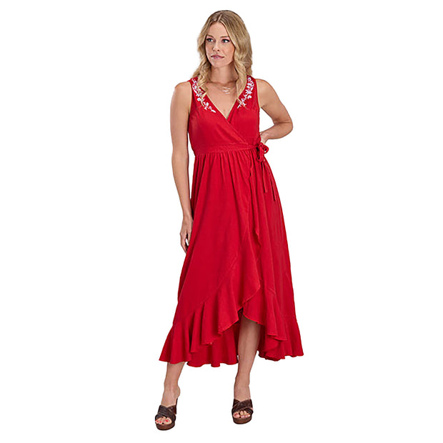 Woman wearing a red dress with floral embroidery on a white background