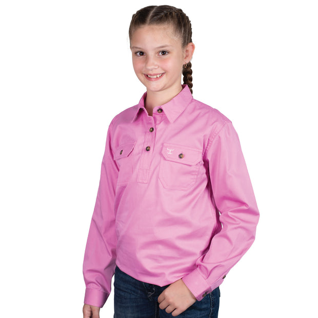 Person wearing a pink shirt with braided hair on a white background