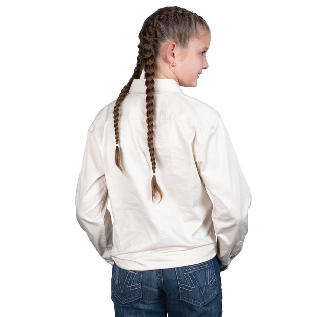 Young girl wearing a white long-sleeve shirt with a logo on a white background