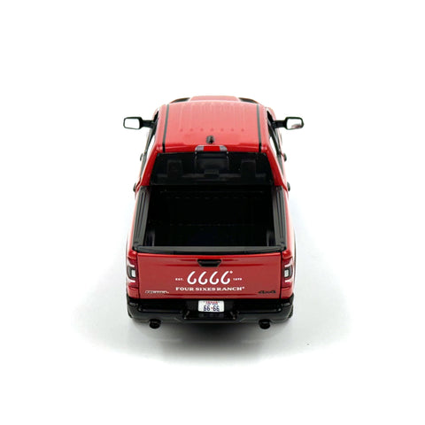 Red model truck with visible branding on a white background