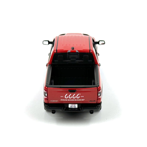 Red model truck with visible branding on a white background