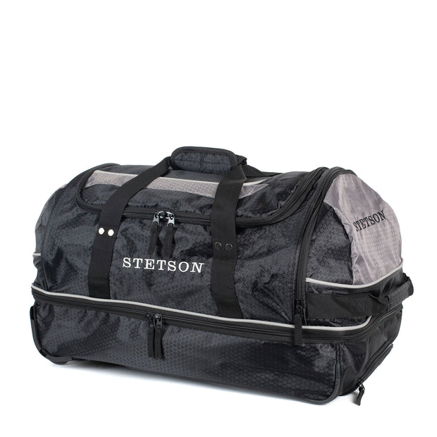 Black Stetson duffel bag with wheels on a white background