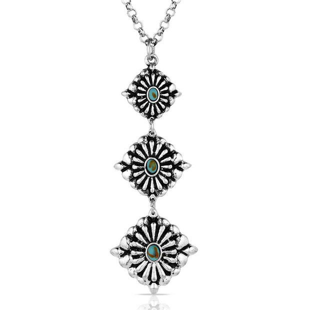 Silver necklace with three sunflower-shaped pendants on a white background