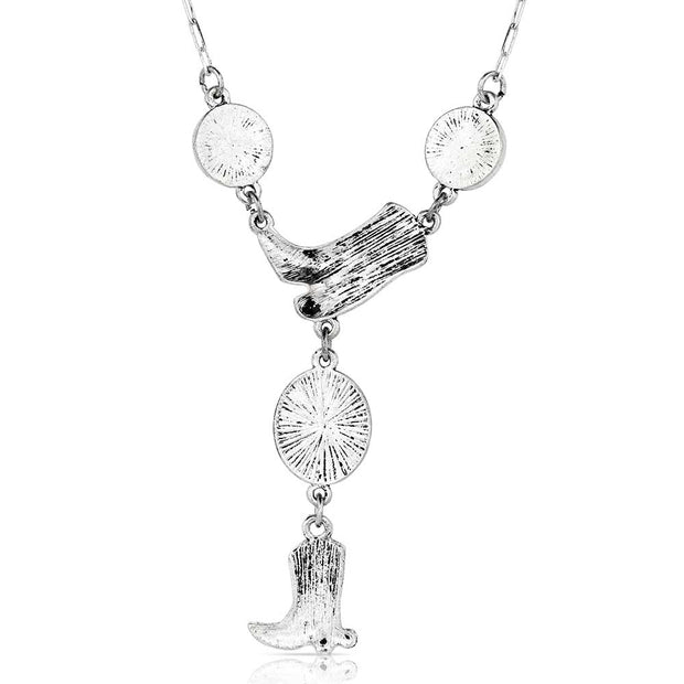 Necklace with turquoise stones and cowboy boot charm on a white background