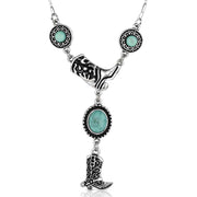 Necklace with turquoise stones and cowboy boot charm on a white background