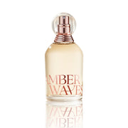 Perfume bottle labeled 'Amber Waves' on a white background