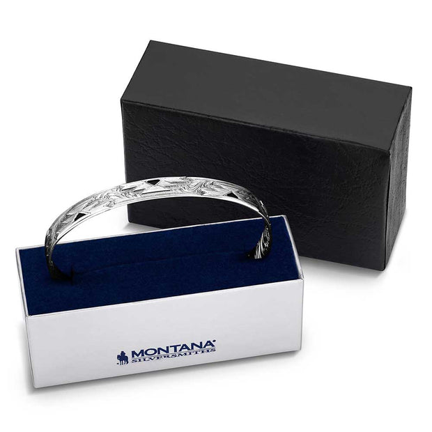 Silver bracelet in a Montana Silversmiths box with a black background
