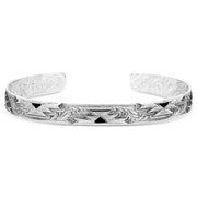 Silver bracelet with intricate patterns on a white background