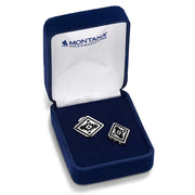 Pair of silver cufflinks in a blue velvet box with 'Montana Silversmiths' branding.