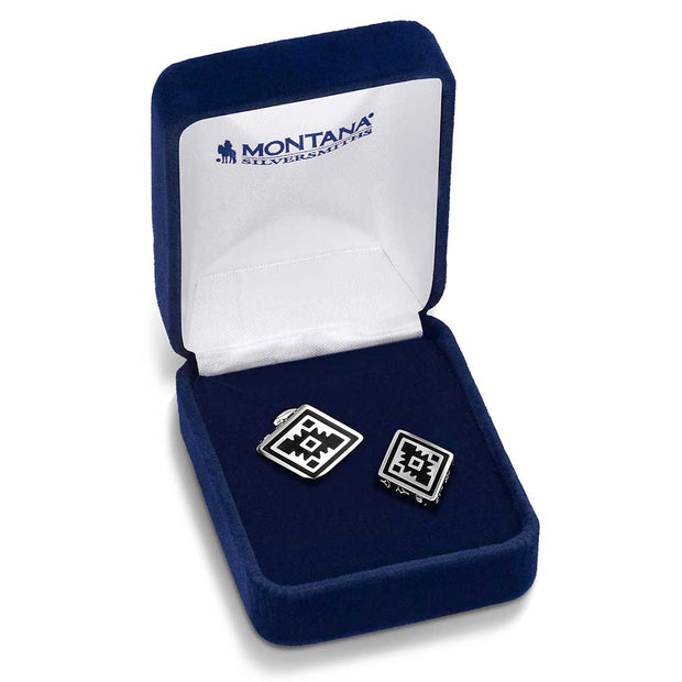 Pair of silver cufflinks in a blue velvet box with 'Montana Silversmiths' branding.