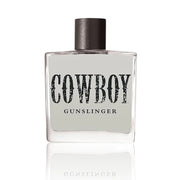 Perfume bottle labeled 'Cowboy Gunslinger' on a white background