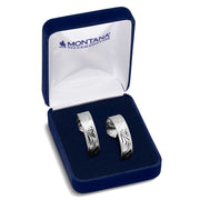 Silver earrings in a Montana Silversmiths box on a white background