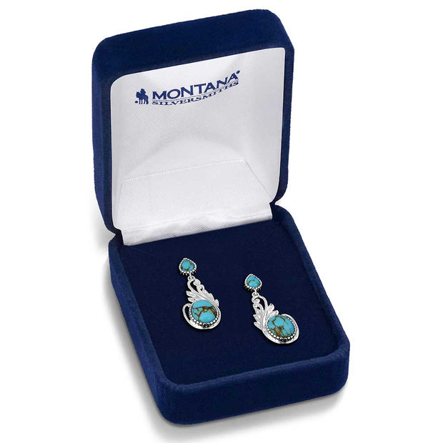 Pair of silver earrings with turquoise stones in a Montana Silversmiths box.
