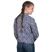 Young girl wearing a blue floral shirt on a white background