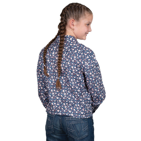 Young girl wearing a blue floral shirt on a white background