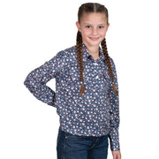 Young girl wearing a blue floral shirt on a white background