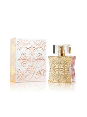 Perfume bottle and packaging with intricate designs on a white background