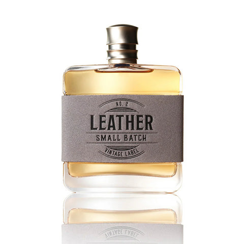 Perfume bottle labeled 'Leather Small Batch' on a white background