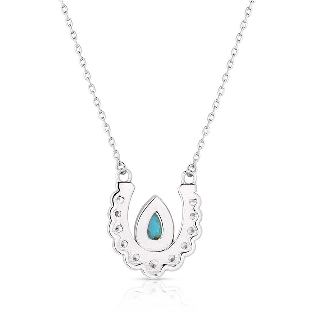 Necklace with a turquoise pendant on a white background