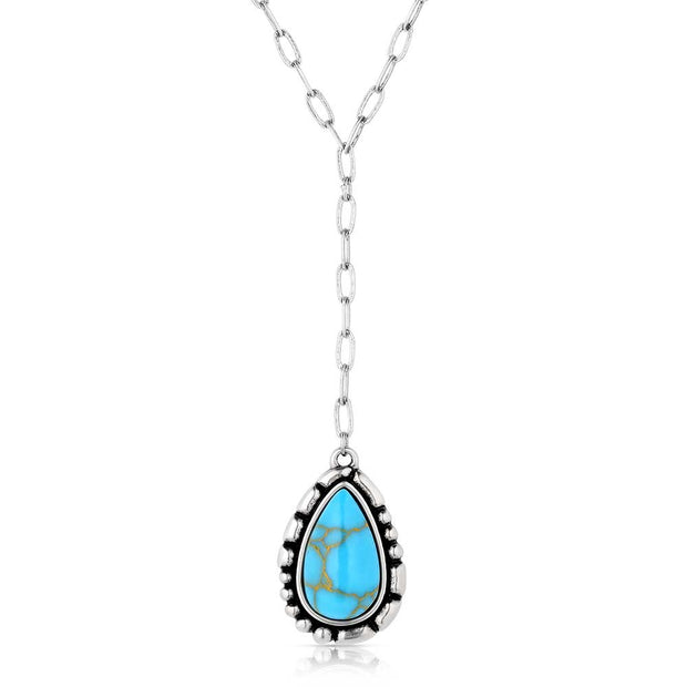 Necklace with a teardrop-shaped turquoise pendant on a white background