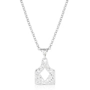 Silver necklace with a detailed pendant on a white background