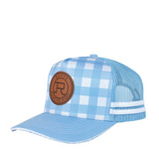 Blue checkered cap with a brown leather patch on a white background
