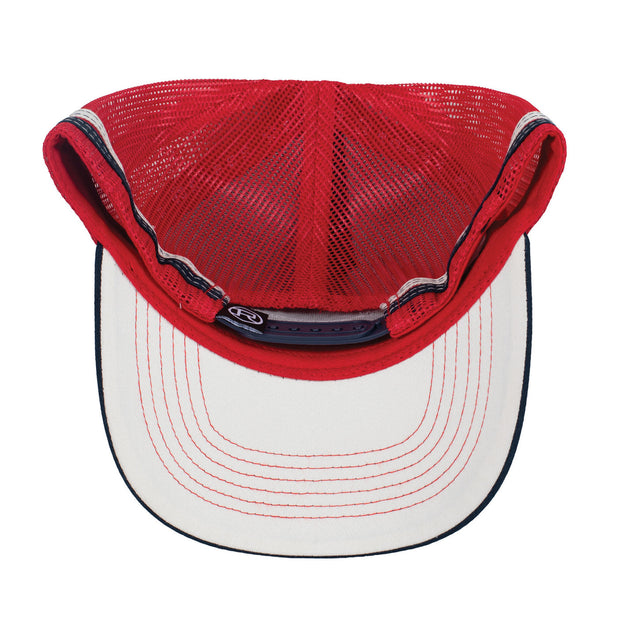Red and navy trucker hat with mesh back and leather patch on a white background