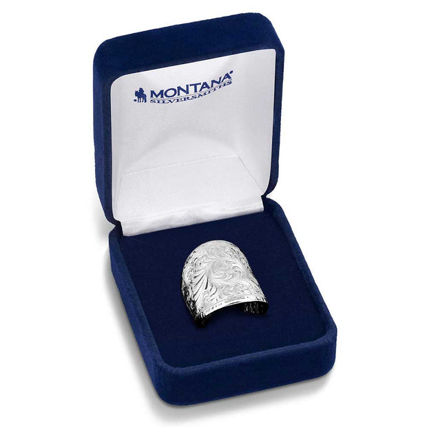 Silver ring in a blue Montana Silversmiths box on a white background