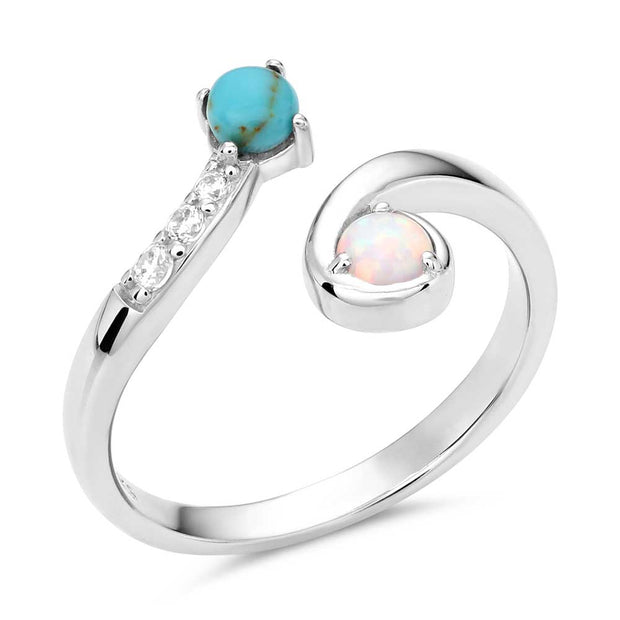 Silver ring with turquoise and opal stones on a white background