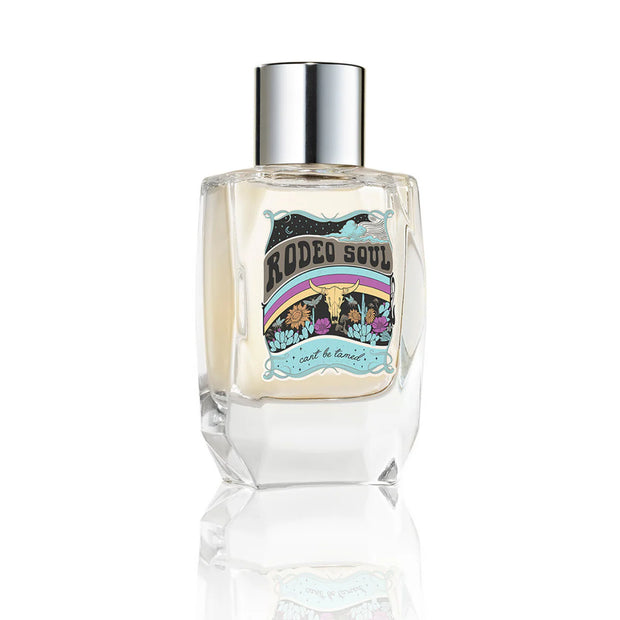 Perfume bottle with colorful label on a white background